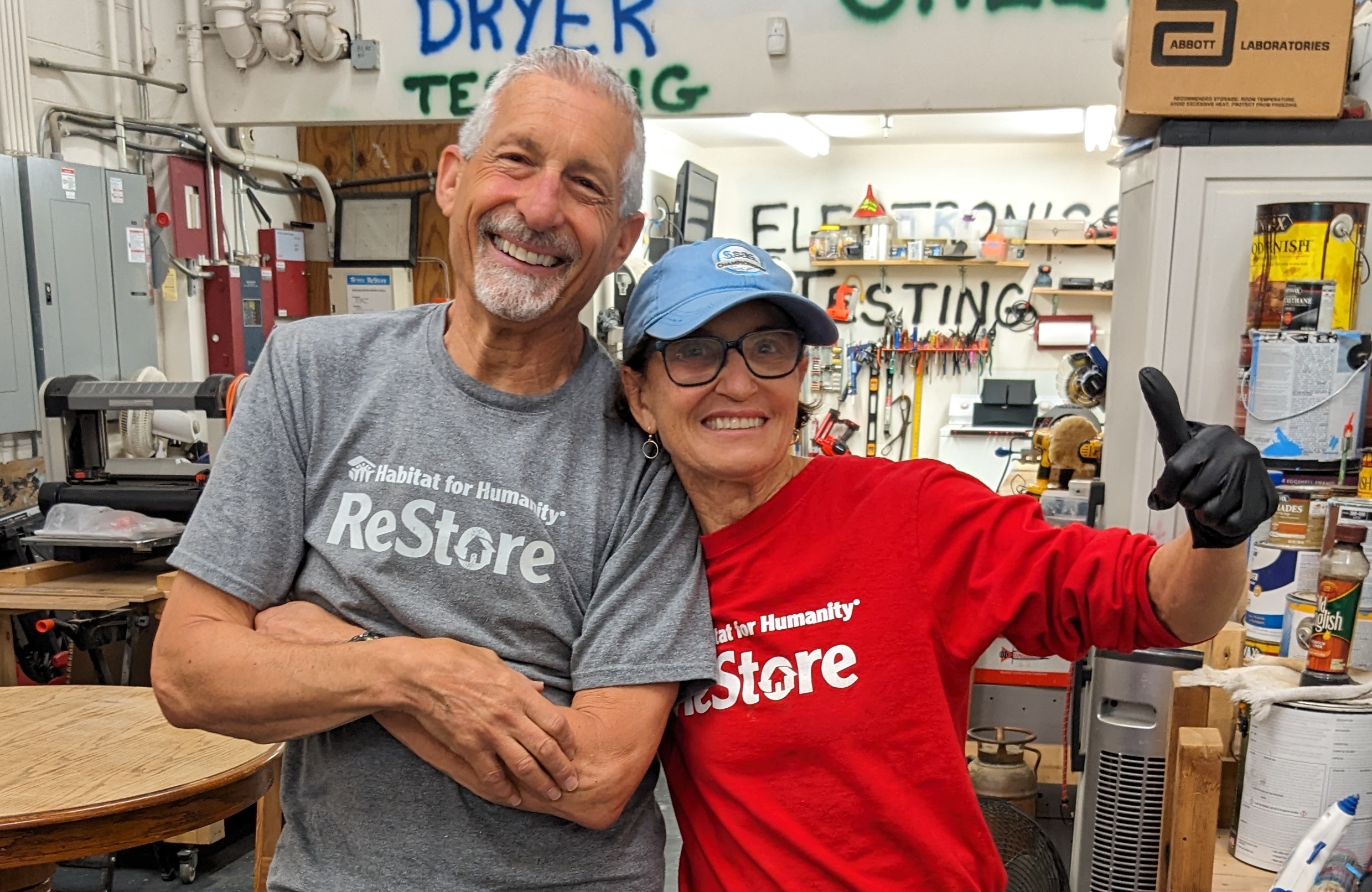 Paul stands with volunteer at the Brier Creek ReStore