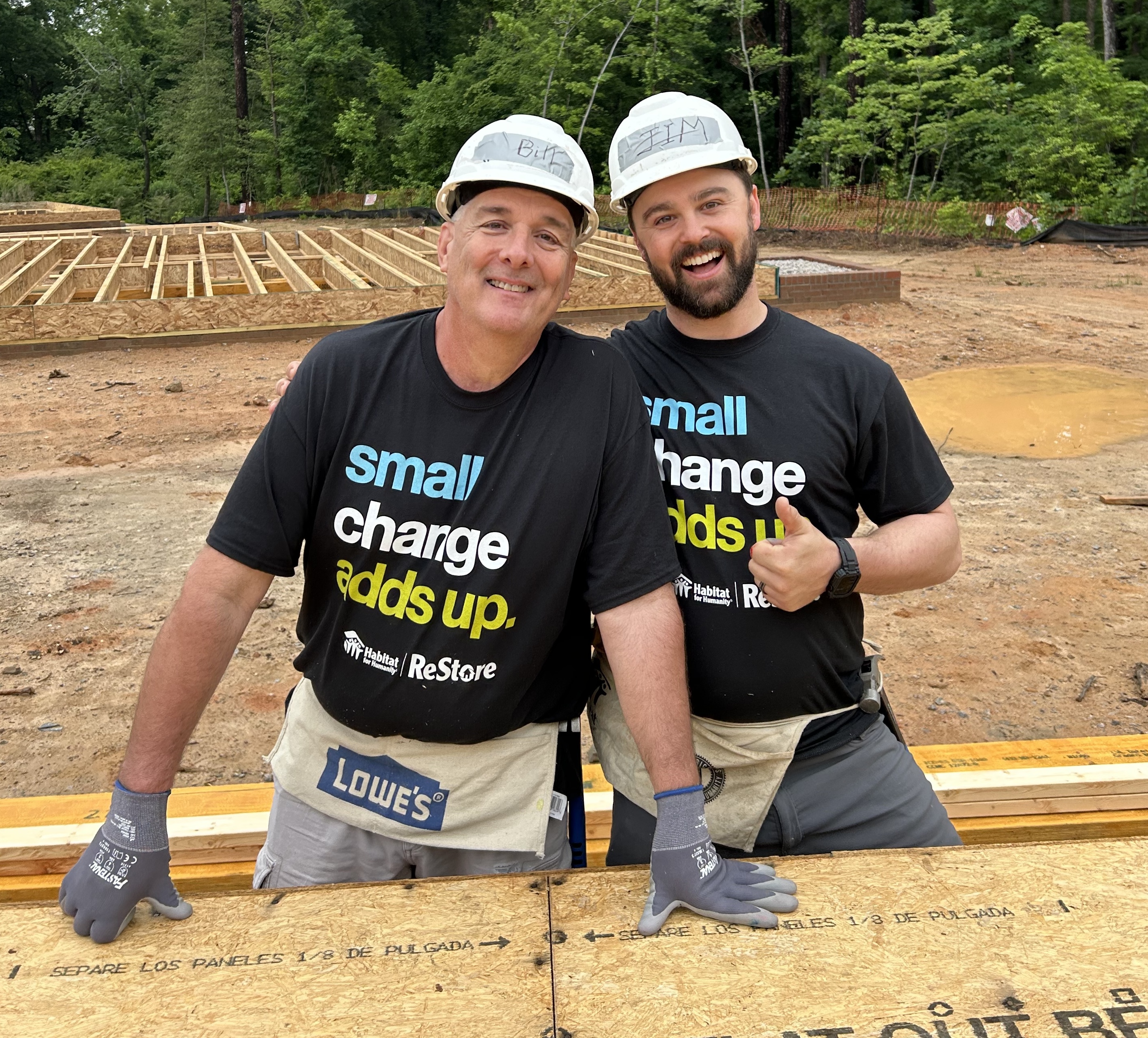 manager and assistant manager of durham restore on construction site with habitat wake