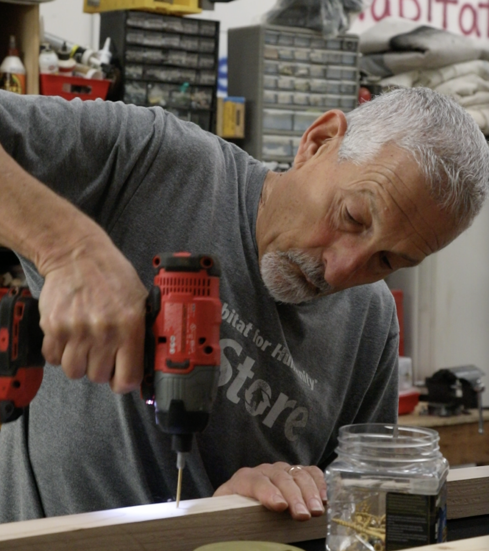 Paul Leifer, volunteer, working on handmade bench